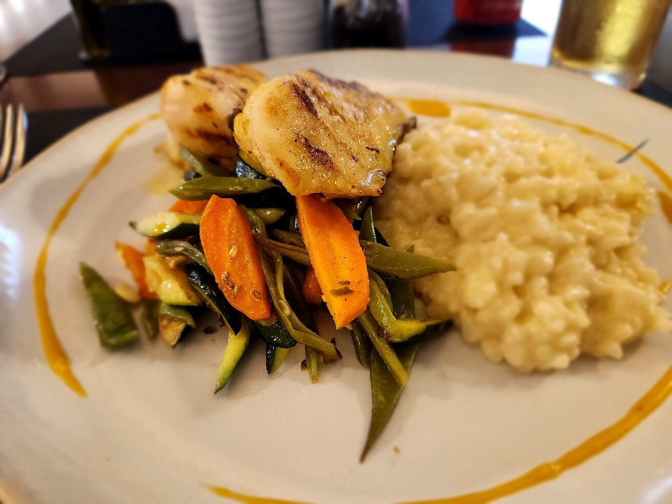 Grilled fish with vegetables and risotto